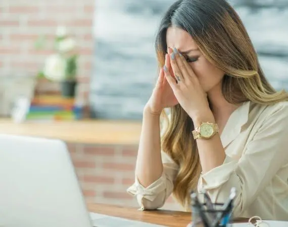 Stressed businesswoman seeking spiritual guidance, blending faith and business for success