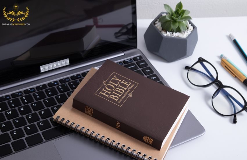 Business Scriptures – Bible Verses for Success & Growth - 1 - https://businessscriptures.com An open Bible surrounded by business items on a desk, signifying the importance of bible verses in the growth and success of Christian entrepreneurship for Business Scriptures.