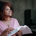 Christian entrepreneur reading bible verses about minding your business on Business Scriptures.